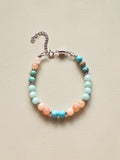 Beaded bracelet with multicolored beads on a beige background