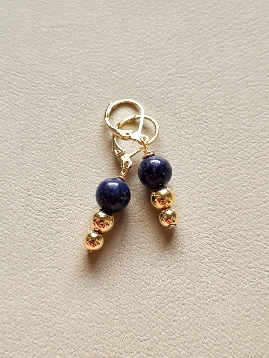 pair of 14k gold filled earrings with lapis stone