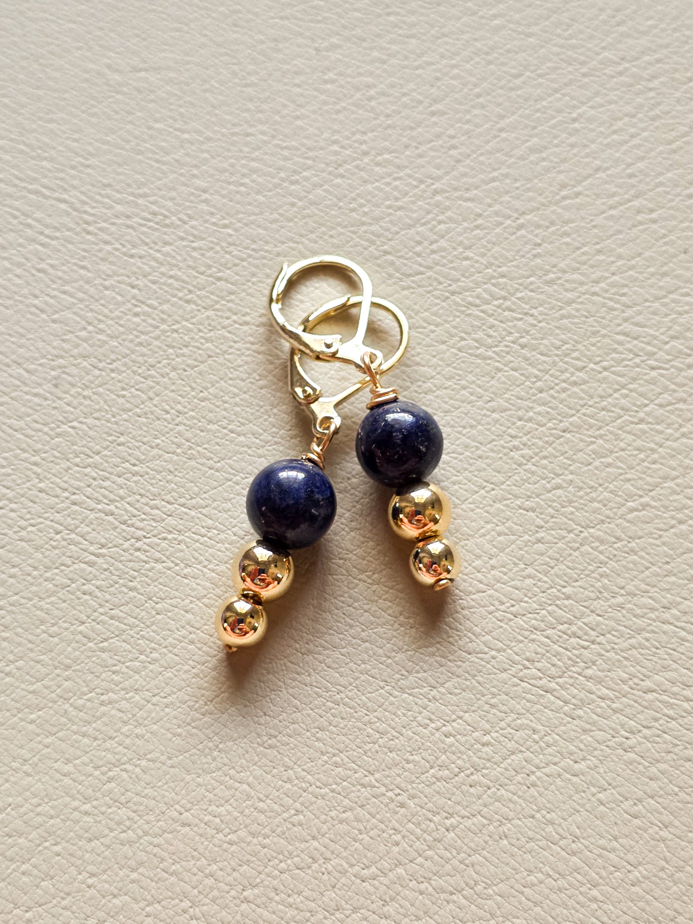 pair of 14k gold filled earrings with lapis stone