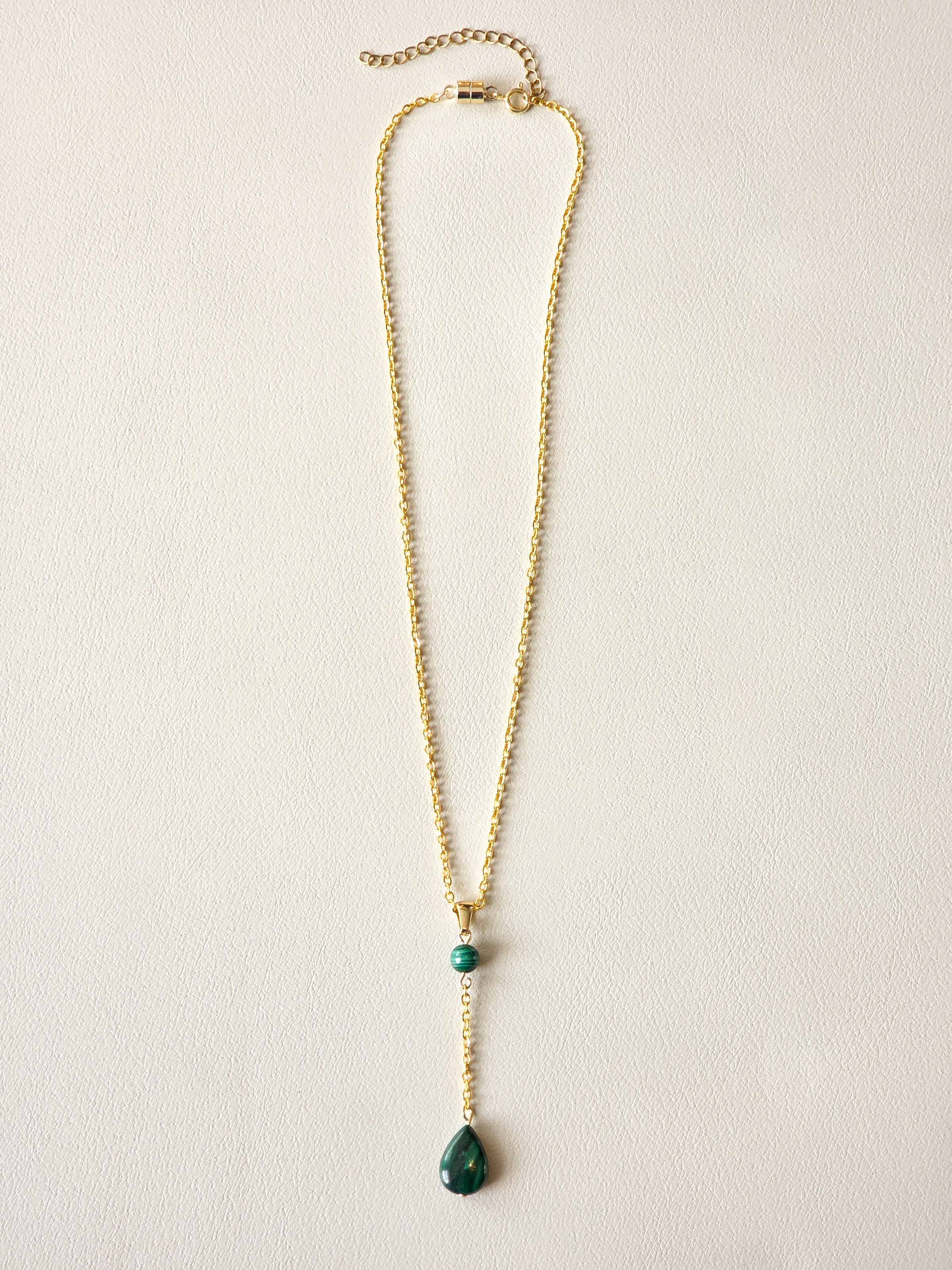 Malachite drop pendant necklace with gold PVD stainless steel chain and polished green stone details.