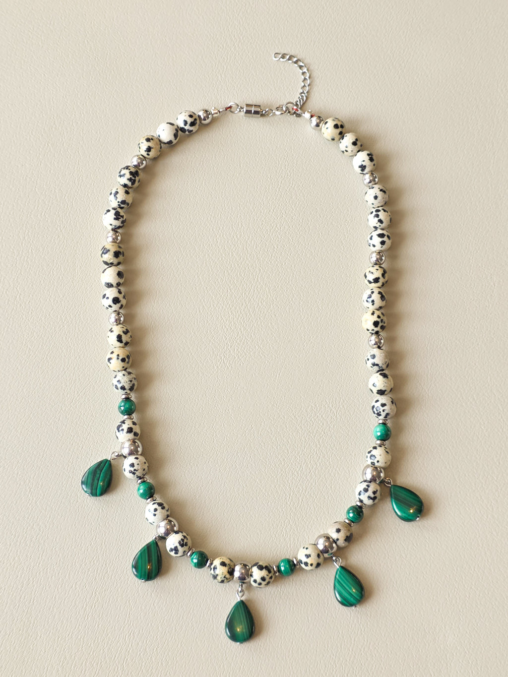 Malachite and Dalmatian Jasper beaded necklace with silver filled accents and dangling green stone charms.